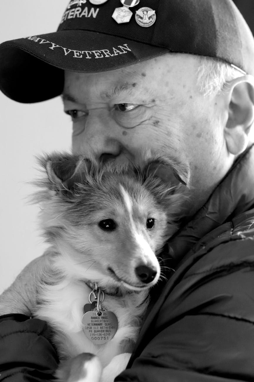 a man hugging a puppy